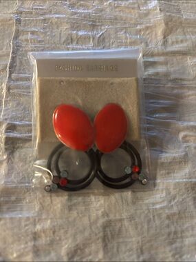 Bold Red Oval Drop Hoop Earrings with Decorative Accents
